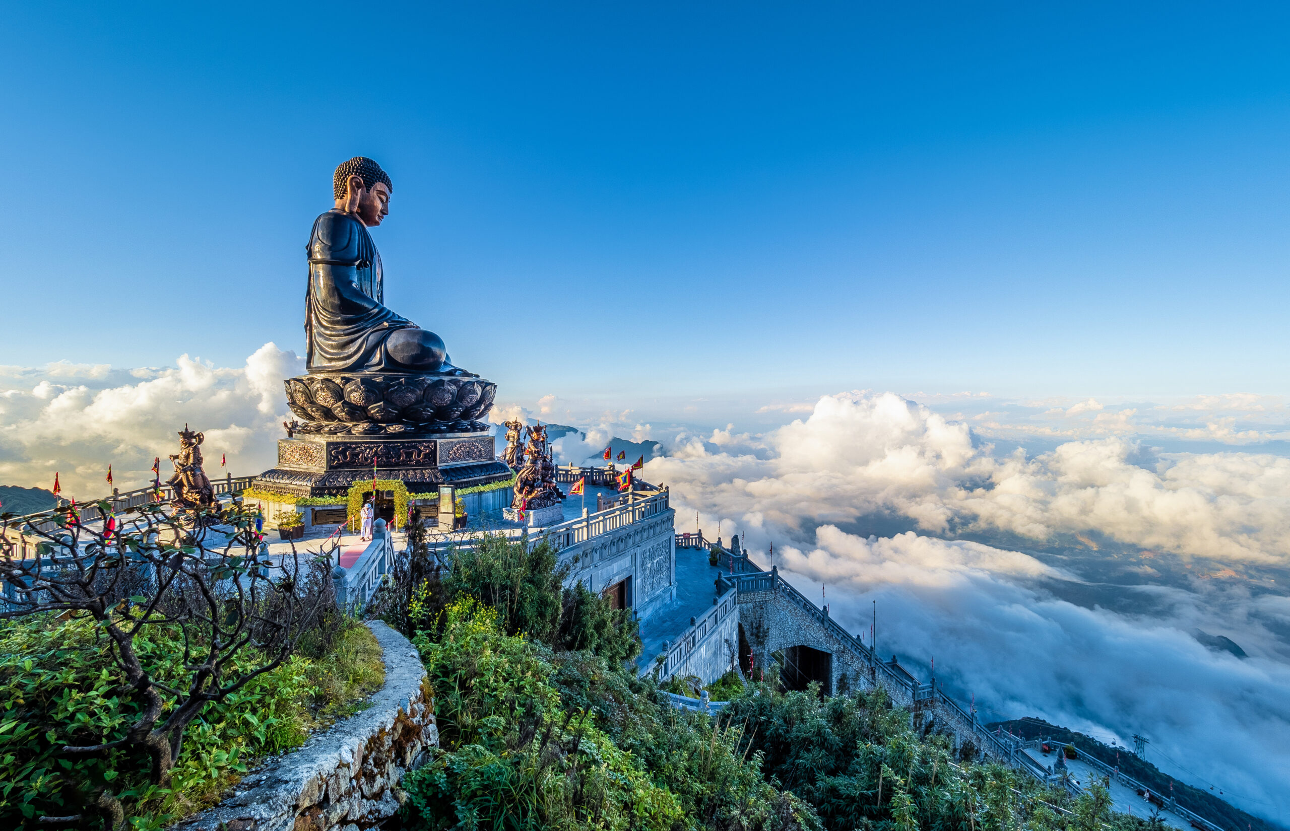 Landscape with 
Giant Buddha statue on the top of mount Fansipan, Sapa region,  Lao Cai, Vietnam