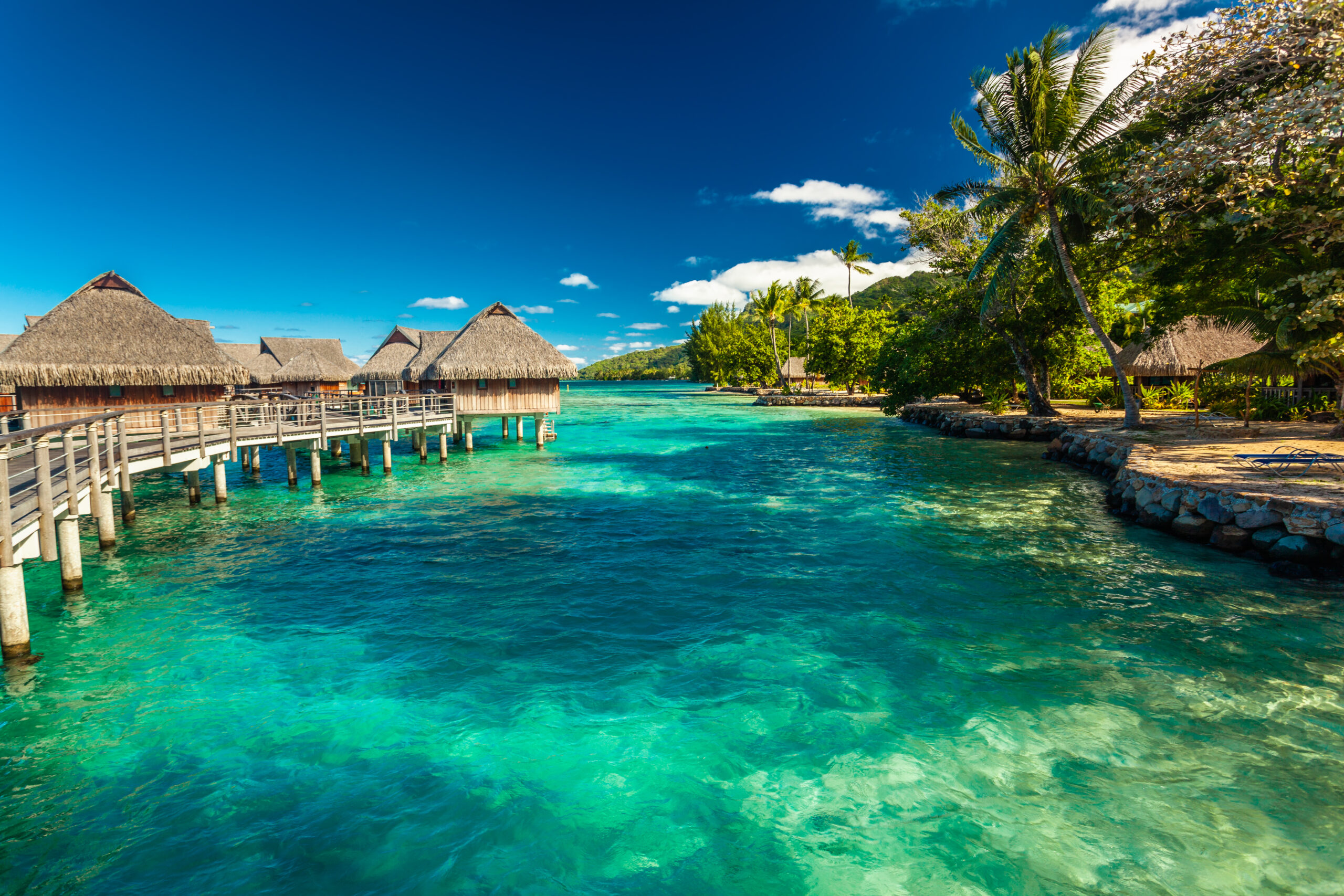 Over water bungalow with steps into amazing lagoon, Moorea, Tahiti